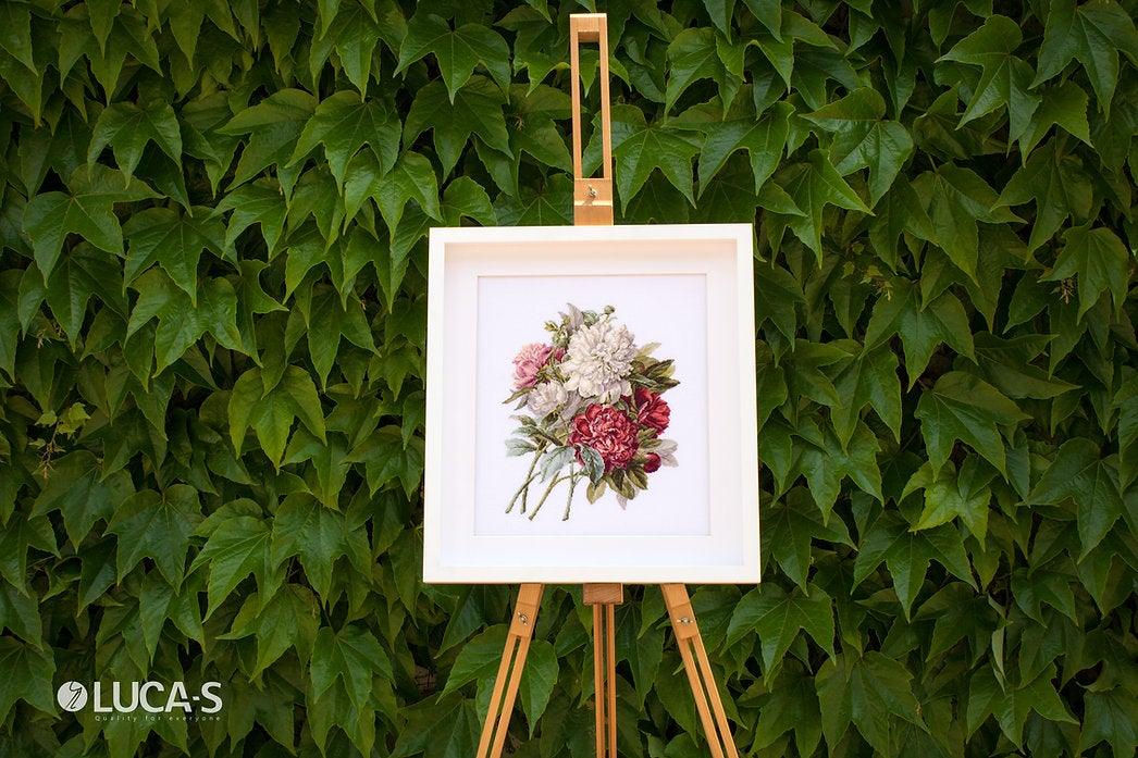 Piones B2355L Counted Cross-Stitch Kit featuring colorful threads, canvas, and needle for crafting.